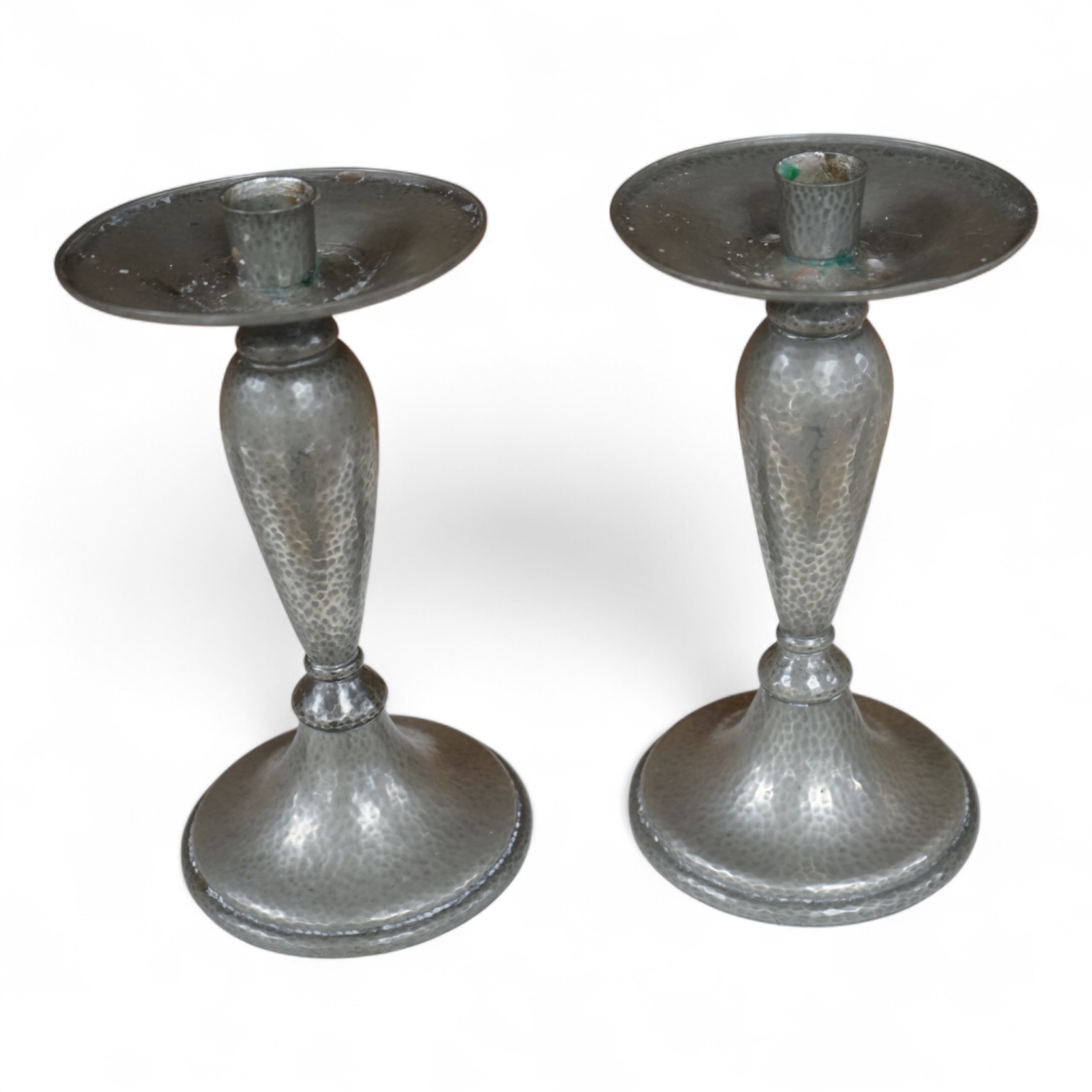 A pair of Liberty Tudric pewter candlesticks, numbered 01223 to the bases, 24cm high